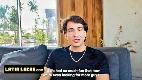 Handsome young Latino guy smiling on couch in black shirt from Latin Leche gay video