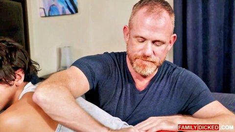 Mature bearded DILF spanks young twink's bare ass cheeks in bedroom