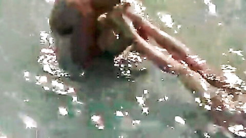 Blonde nudist fucked in shallow beach water