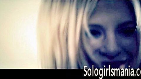 Scarlet Red blonde smiling seductively in solo tease