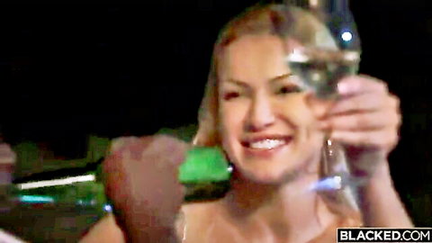 Blonde woman toasting champagne with BBC partner in teasing threesome preview