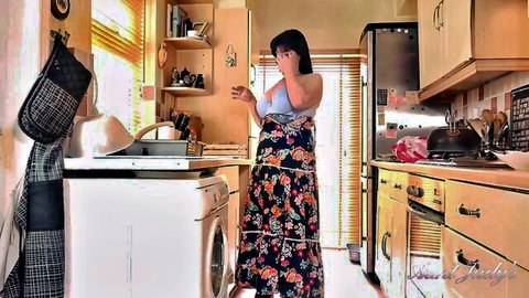 Chunky Asian mom in floral dress on emotional phone call, teasing cleavage