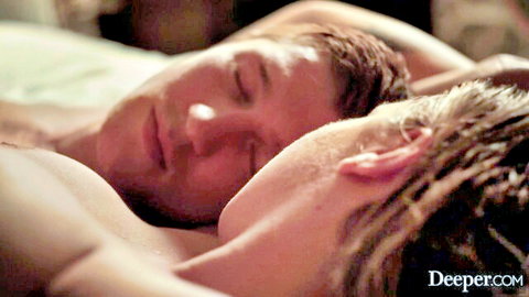 Two muscular men cuddling shirtless in bed, Gabbie Carter scene