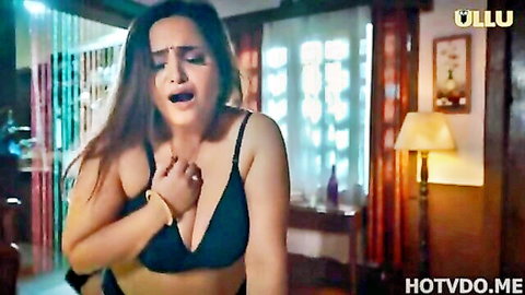 Busty Indian woman in black bra, aroused expression from Tadka Ullu web series