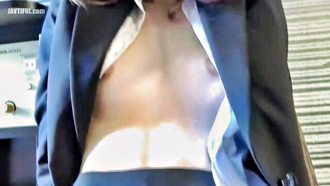 Asian beauty with model body in open blue suit exposing toned chest