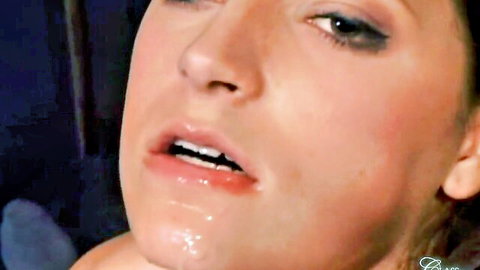 Close-up of aroused woman with cum dripping from glossy lips in intense oral scene