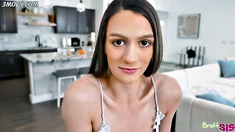 Brunette stepsis in white tank top, seductive smile in kitchen tease