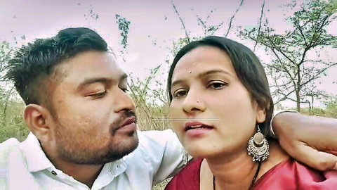 Desi Kavita Bhabhi in red saree embraces lover in wild jungle setting