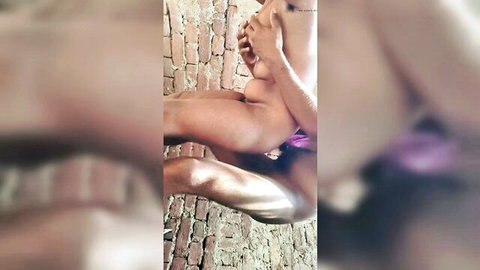 Young Indian woman spreads legs wide fingering wet pussy against outdoor brick wall