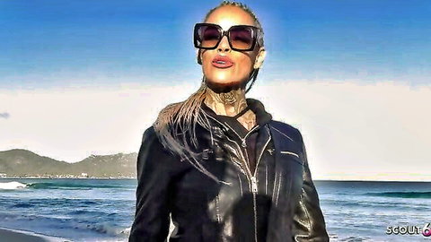 Sophie Logan German MILF in leather jacket on beach, seductive pose
