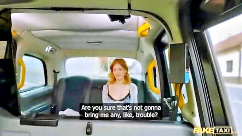 Redhead babe in Fake Taxi, white lacy top, concerned passenger vibe