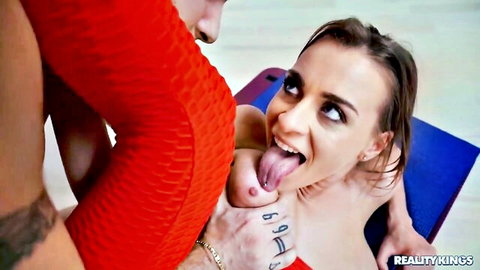 Brunette with huge tits licks man's tattooed fingers while he squeezes her big boobs