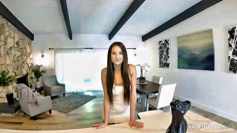 Sexy Asian teen babe in tight white tank top leaning over table teasing cleavage POV