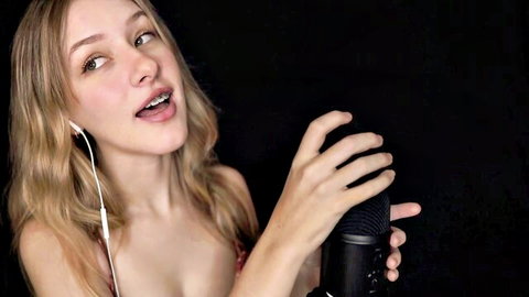 Blonde ASMR girl sensually pumping microphone close-up