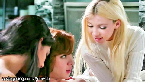 Blonde in white sweater seduced by two horny lesbians in close foreplay tease