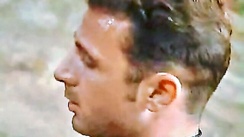 Sweaty male performer in Gina Wild gangbang scene, intense profile view