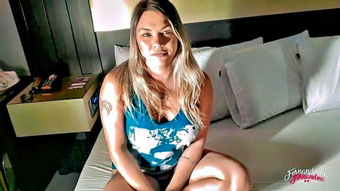 Fernandinha Fernandez blonde Brazilian in low-cut tank top, teasing pose