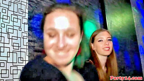 Two smiling European women at wild party, blurry club fun thumbnail