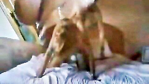 Noemi bent over in doggy style, getting penetrated from behind in steamy bedroom scene