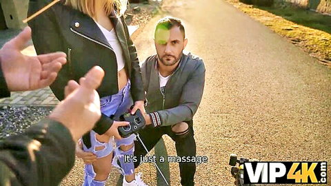 Kneeling guy massages thighs of hot blonde in ripped jeans publicly outdoors