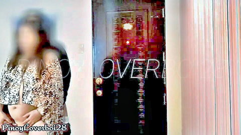 Pregnant Asian woman in sexy off-shoulder top, teasing at door