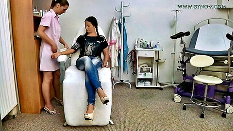 Cute brunette in jeans gets gyno exam from nurse in pink scrubs