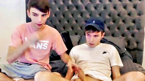 Gay teen boys on webcam bed groping each other's cocks through shorts