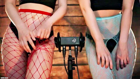 Two women in red and blue fishnets tease pussies with hands by ASMR mics