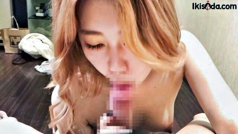 Stunning Asian model with orange hair giving sloppy nude blowjob close-up