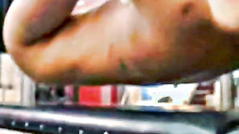 Close-up of bound tan arm in BDSM restraint