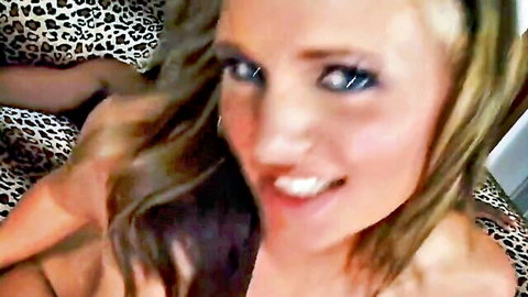 Blonde amateur babe smiling closeup selfie on leopard print sheets showing cleavage