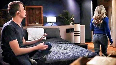 Blonde stepmom in blue top teases stepson on birthday bed