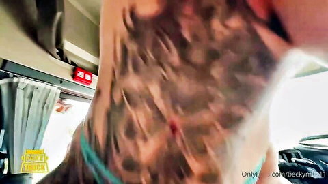 Tattooed babe grips hairy cock base in bus POV handjob closeup