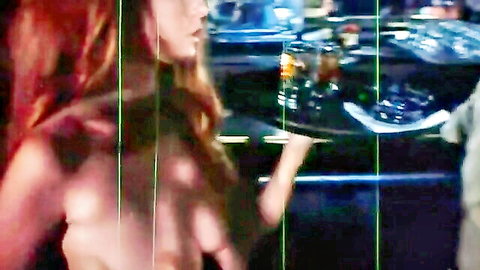 Busty redhead undresses topless on podium for judges