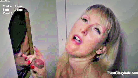 Blonde MILF Sofie gripping and sucking cock at gloryhole with Miulo