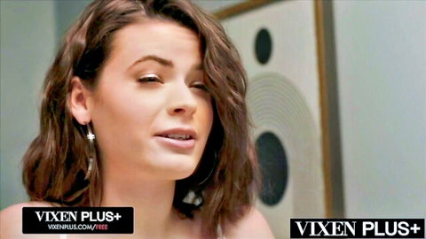 Seductive brunette beauty with sultry eyes and parted lips teasing oral pleasure