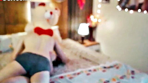 Girl spreads legs fingering pussy in gray panties with giant teddy bear on bed