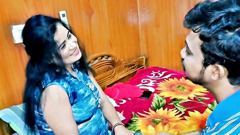 Sexy Indian MILF in tight blue top gazes intimately at boyfriend on colorful bed