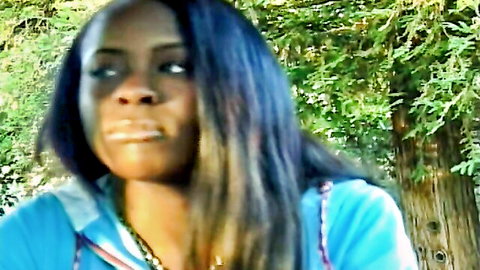 Ebony babe with blue hair opens mouth wide teasing cock sucking outdoors