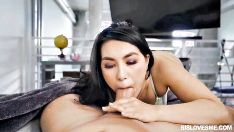 Asian teen sister in lingerie giving oral to stepbro on bed, taboo blowjob