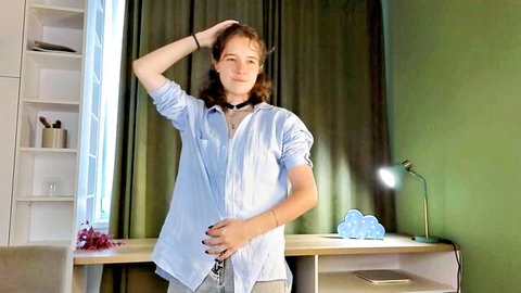 Cute shy 18yo Wilonebendell in open blue shirt, Chaturbate camgirl pose