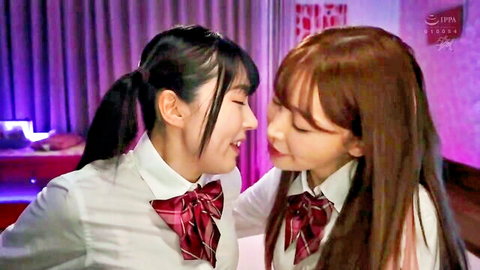 Petite Japanese schoolgirls in uniforms leaning in for sensual lesbian kiss tease