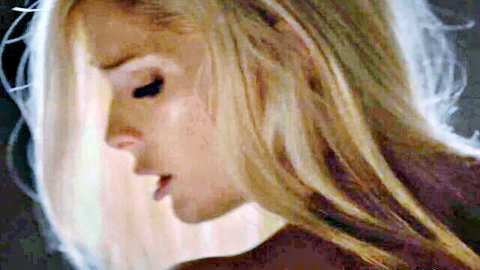Sensual blonde MILF in profile with parted lips and sultry gaze teasing blowjob fantasy