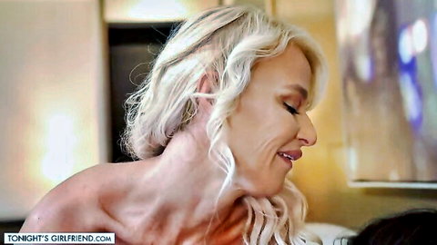 London River blonde MILF smiling seductively in topless pose
