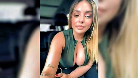 Blonde babe in low-cut green top showing big cleavage tease
