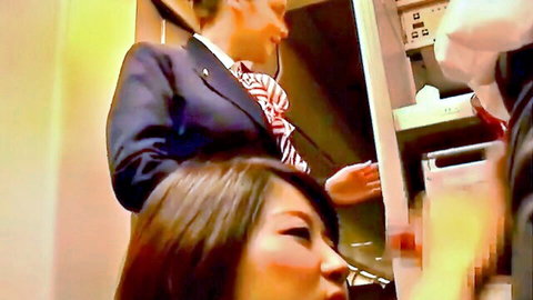Asian woman in suit giving blowjob in intimate scene
