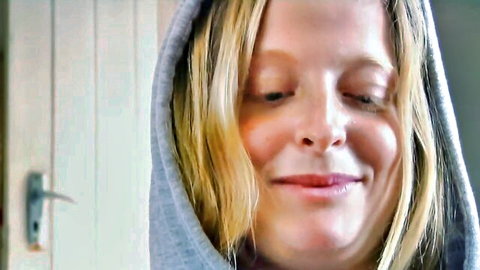 Blonde Alena in gray hoodie smiling close-up, seductive HD adult video thumbnail