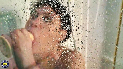 Shameless granny munching yellow treat in steamy shower