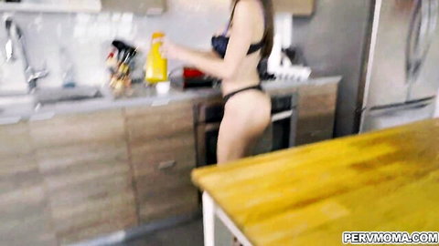 Sexy Asian MILF in black lingerie bending over, showing big ass