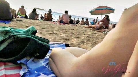 Young Brooke Haze nude on beach, legs spread exposing pussy during outdoor hazing